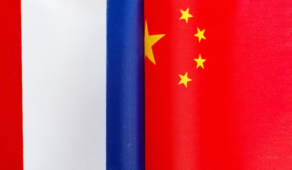 fragments of national flags of France and China close-up