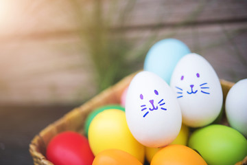 Fototapeta na wymiar Colorful Easter eggs on the basket