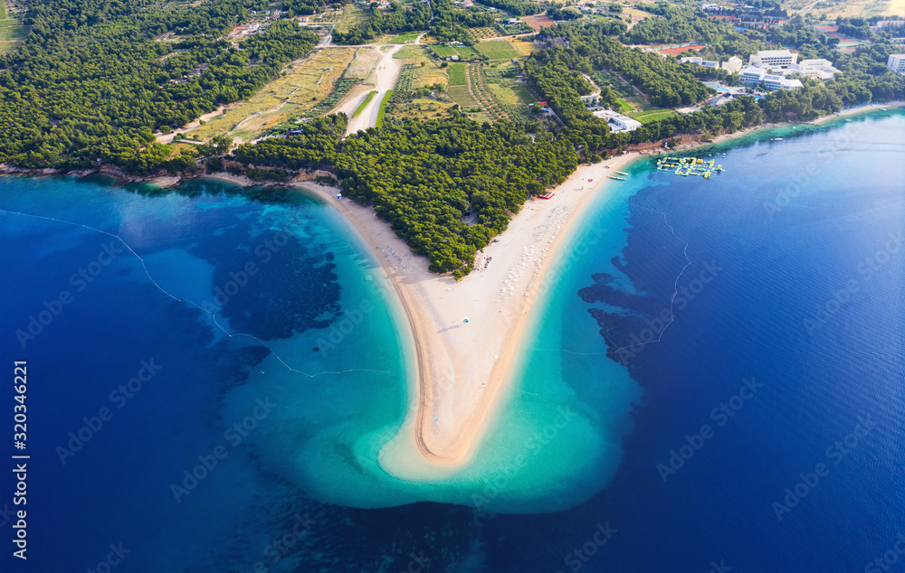 Wall mural Croatia, Hvar island, Bol. Aerial view at the Zlatni Rat. Beach and sea from air. Famous place in Croatia. Summer seascape from drone. Travel - image