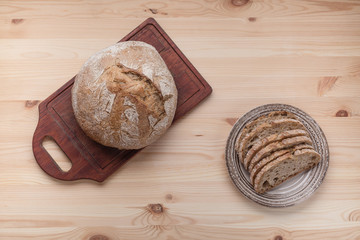 Hot bread on a table made of wood. Copyspace. Template with place for text. Flat lay in country style.