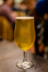 Misty glass with pint of cold Scotch ale, pale ale draft beer in English pub