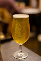 Misty glass with pint of cold Scotch ale, pale ale draft beer in English pub