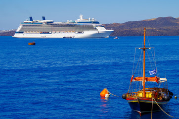 Luxury cruise ship liner or cruiseship anchoring in bay at sea in front of Greek Island during...