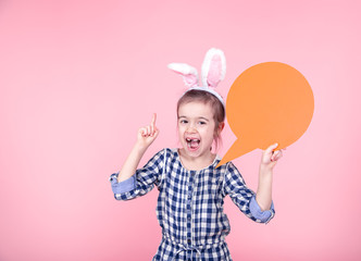 Easter portrait of a cute little girl with space for text.