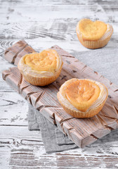 Puff pastry cakes with vanilla cream. Traditional Portuguese dessert Pasteis de Belem