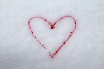 Red heart painted with red paint on snow symbol of love postcard for Valentines Day