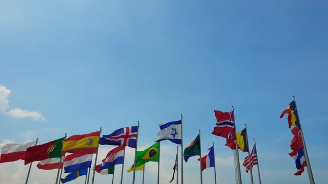 International colorful national flags sway in outdoor wind abstract of world collaboration