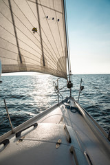 yacht sailing in sun lights