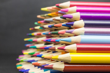 heap of multicolored pencils viewed sideways