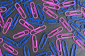 background of blue and pink paper clips