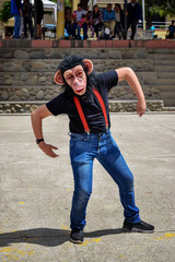 Man costume jumpsuit monkey happy open arms hands