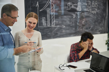 Creative team working on project in modern office