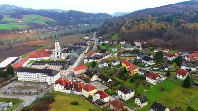 Small village near Linz with big Catholic Churce, Danube river and woods