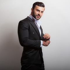 Handsome young elegant man studio portrait.