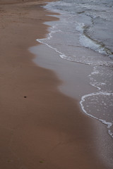 pastel colours sea side sand and water