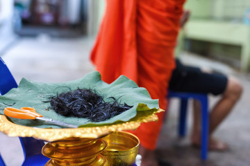 Cut hair for Buddhist ordination
