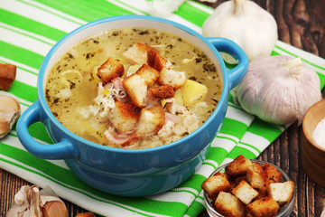 A bowl with traditional Czech garlic soup cesnecka	