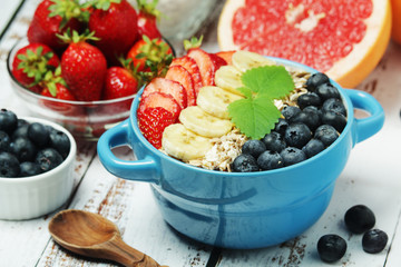Healthy diet breakfast including cereal with berry and fruits	