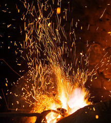 Smithy fire flame tips with sparks closeup