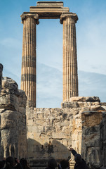 Remains of the temple dedicated to Apollo, the god of light and sun. A closed and cloudy sky behind...