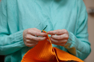Close up of Woman Hand Crochet Woolen Sweater