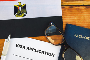 Flag of Egypt  , visa application form and passport on table