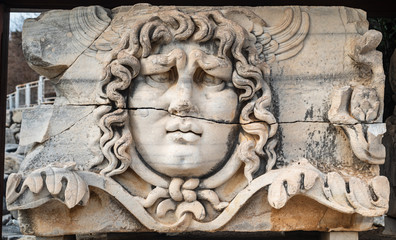 The statue of the mythological entity medusa, known for its snake hair. The head statue, which became the symbol of the temple of Apollo and Didyma. 