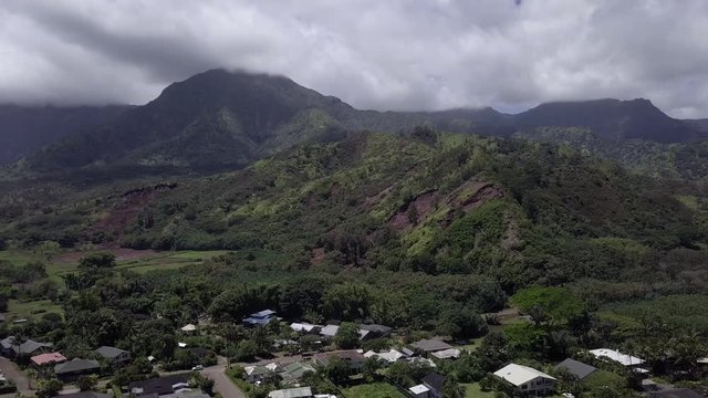 Drone Aerial Footage of Kauai Hanalei, Hawaii. Houses, town, Beach with Ocean waves touching the shoreline after rainfall in may twentyeighten that caused flood.