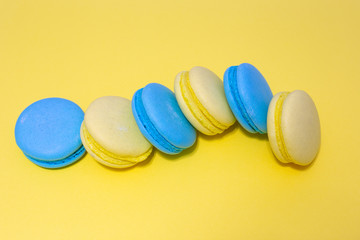 macaroni cookies lies on a yellow background, sweet pastries