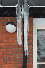 icicles hanging from rain gutter