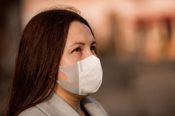 Stop the infection, woman wearing medical mask on the street protection against virus, concept of pollution