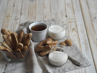 Homemade shortbread biscuits with cinnamon and nuts on a white wooden table. We bake cookies.