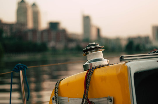 Close Up Yacht Winches And Ropes Details. View On The City At Sunset. Romantic Moment. Rest In Silence. Digital Detox Concept. Man And Nature 