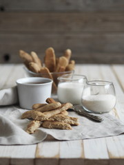 Homemade shortbread biscuits with cinnamon and nuts on a white wooden table. We bake cookies.