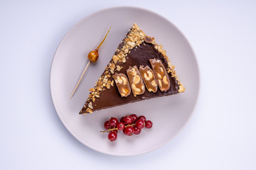 chocolate cake on a plate on a light background1