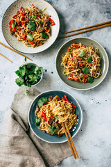 Asian food, udon noodles with vegetables, healthy vegetarian menu - 320363629