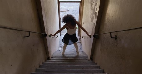 Female dancer in an empty warehouse - Powered by Adobe