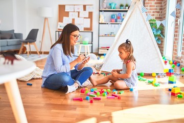 Young therapist woman speaking and treating child, counselor and behaviour correction at pedagogue...