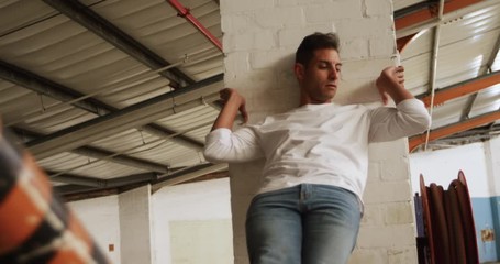 Male dancer in an empty warehouse - Powered by Adobe