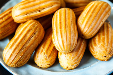  Traditional french eclairs with chocolate. Tasty dessert. Home made cake eclairs  Sweet. Dessert. Pastry filled with cream. Chocolate icing.