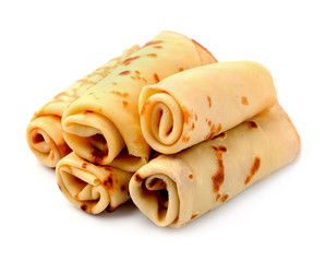 Delicious pancakes rolled isolated on white backgrounds.