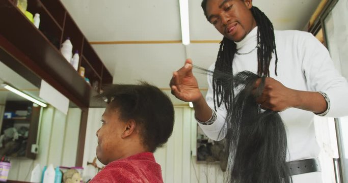 African man preparing the wig