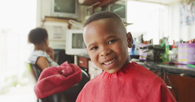 African boy smiling after hair cut