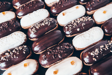  Traditional french eclairs with chocolate. Tasty dessert. Home made cake eclairs  Sweet. Dessert. Pastry filled with cream. Chocolate icing.