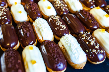  Traditional french eclairs with chocolate. Tasty dessert. Home made cake eclairs  Sweet. Dessert. Pastry filled with cream. Chocolate icing.