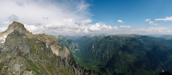 The aerial panorama of the beautiful Rila Mountains during the summer, in the foreground is the Evil Tooth peak. Rila National Park, Bulgaria. View from above high mountains,ridges and peaks.