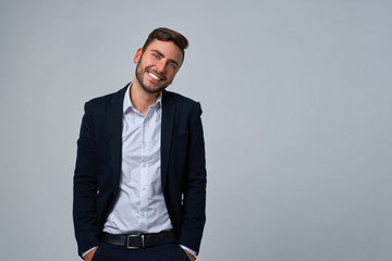 Close up portrait young man businessman. Caucasian guy business suit studio gray background.