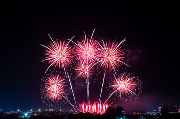 Abstract and brightly colorful firework in the celebration and anniversary festival.Merry Christmas and New year party light over night sky.