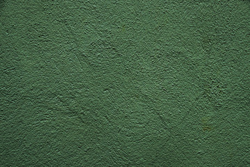 Texture of green crumpled paper. Dark green texture