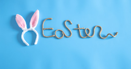 Easter creative inscription on a blue background.